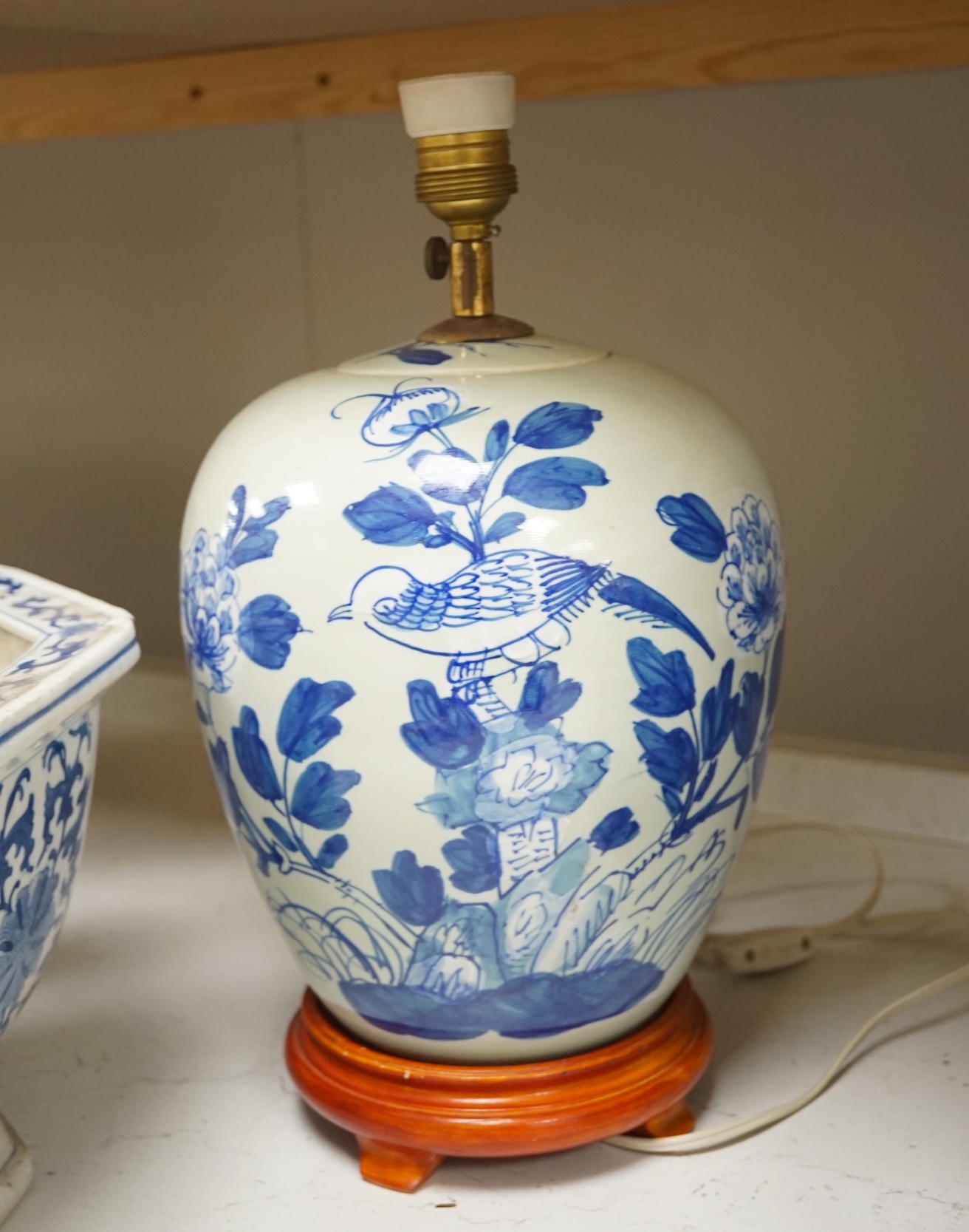 Two Chinese porcelain jars mounted as lamps and a similar blue and white octagonal jardiniere, largest 35cm wide. Condition - good (3)